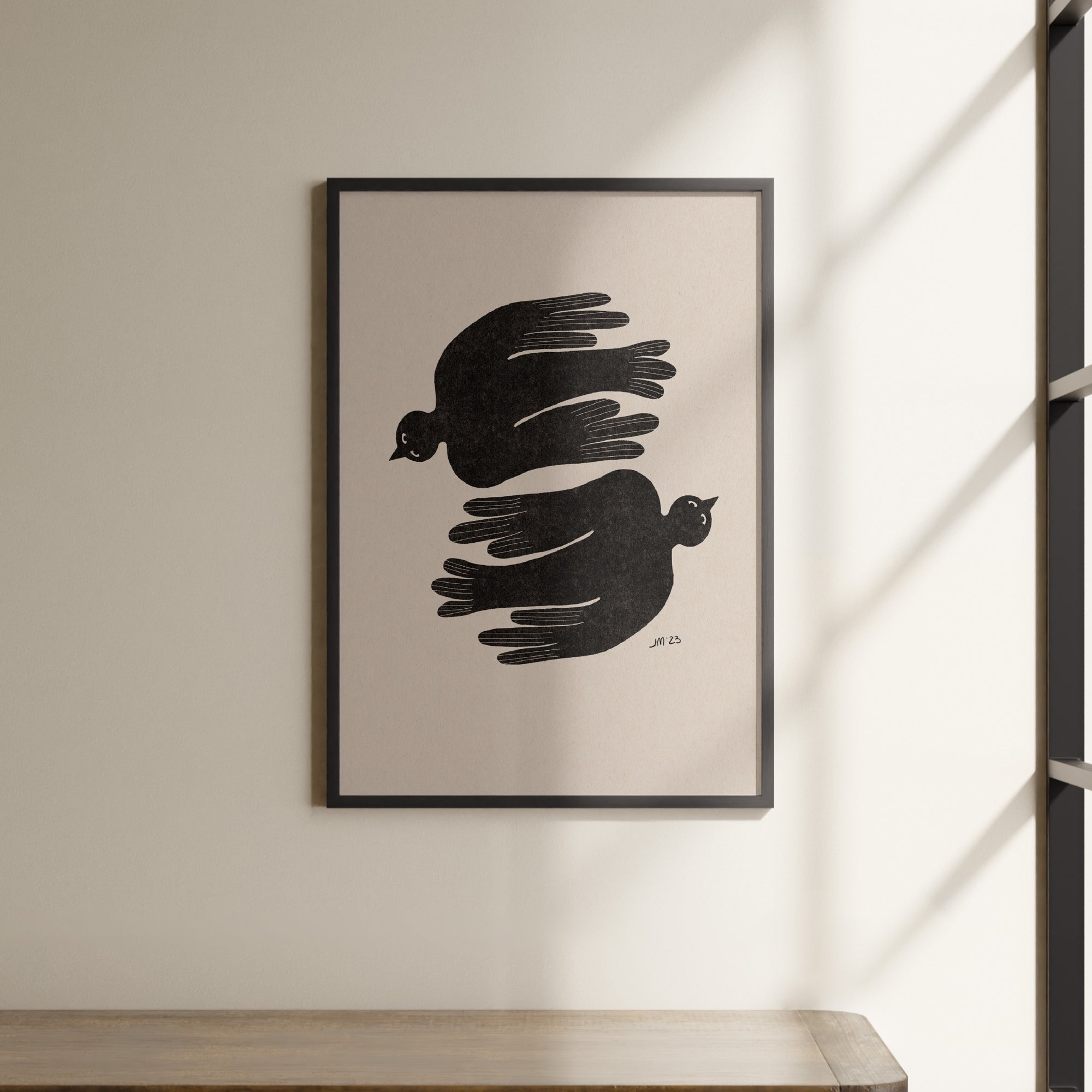 a black and white picture hanging on a wall