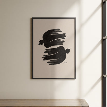 a black and white picture hanging on a wall