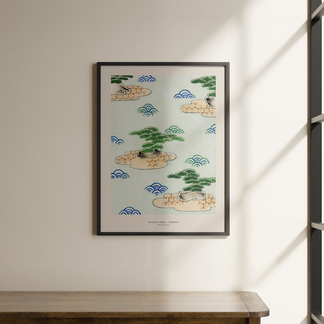 a picture hanging on a wall above a wooden table