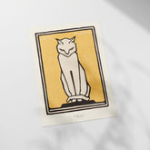 a white cat sitting on top of a table