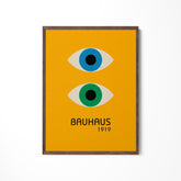 a yellow poster with two blue and green eyes