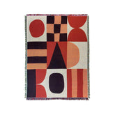 a red, black, and white rug with a design on it
