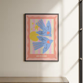 a picture hanging on a wall above a shelf