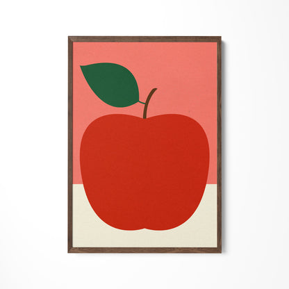 a picture of a red apple with a green leaf