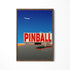 a picture of a pinball sign with a plane in the background