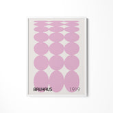 a pink poster with a number of circles on it