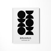 a black and white poster hanging on a wall