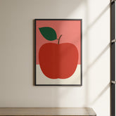 a picture of an apple hanging on a wall