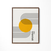 a picture of a yellow circle on a white wall